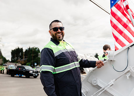 man safety vest trash collector truck exterior